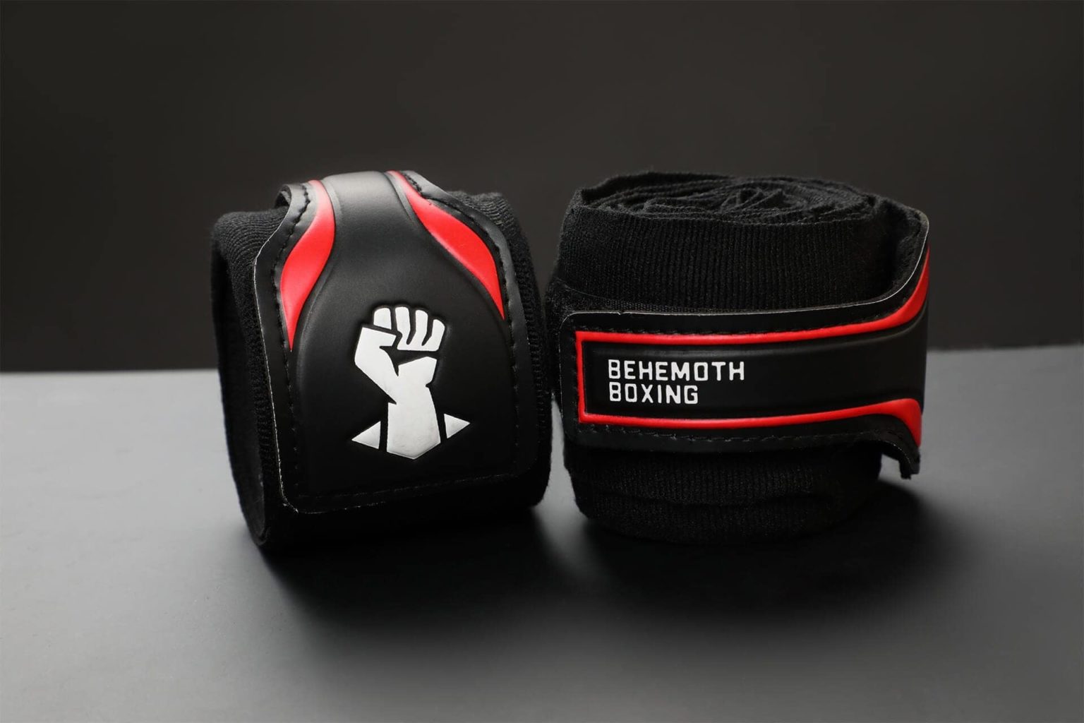 Behemoth Boxing logo design shown on black handwraps